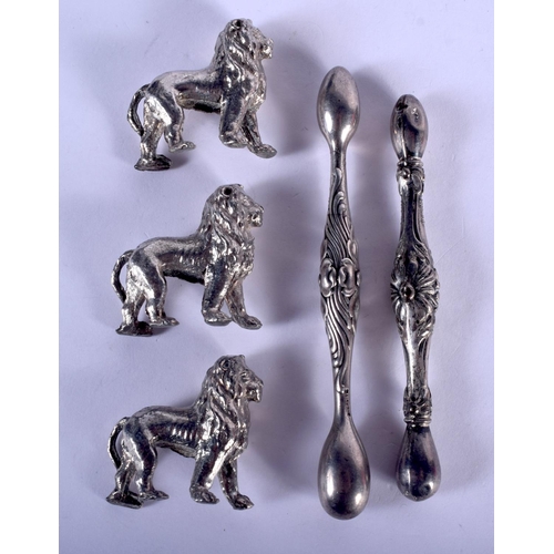 1115 - THREE WHITE METAL LIONS and a pair of sterling silver knife rests. 120 grams overall. Largest 11 cm ... 