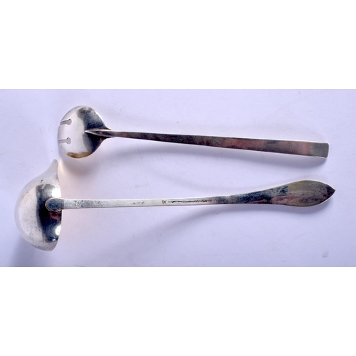 1121 - TWO SILVER SPOONS. 61 grams. Largest 20 cm long. (2)