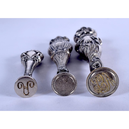 1123 - THREE STERLING SILVER SEALS. 45 grams. Largest 9.5 cm high. (3)