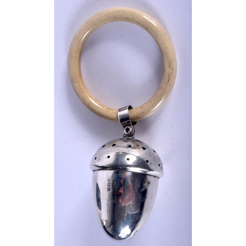 1126 - AN ART DECO SILVER ACORN FORM BABIES TEETHING RATTLE. 22 grams. 11 cm x 5 cm.