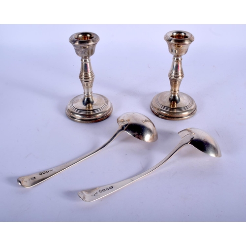 1136 - A MATCHED PAIR OF 18TH/19TH CENTURY SILVER LADLES together with a pair of silver candlesticks. Ladle... 