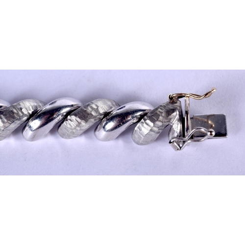 1145 - AN 14CT WHITE GOLD ITALIAN CURVING BRACELET. 24 grams. 18 cm long.