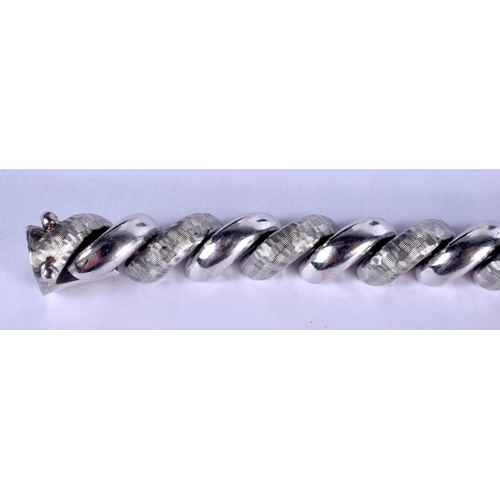 1145 - AN 14CT WHITE GOLD ITALIAN CURVING BRACELET. 24 grams. 18 cm long.