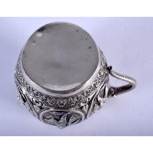 1152 - AN ANTIQUE INDIAN SILVER JUG. 139 grams. 10 cm x 8 cm.