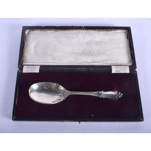 1161 - A RARE VINTAGE SILVER AND ENAMEL SPOON. 41 grams. 17 cm long.