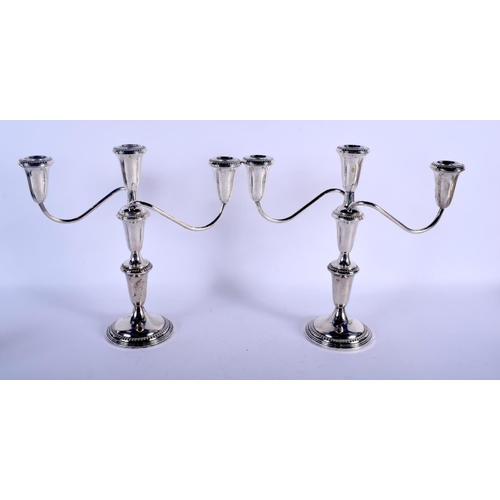 1185 - A PAIR OF STERLING SILVER CANDELABRA. 1700 grams weighted. 27 cm x 25 cm.