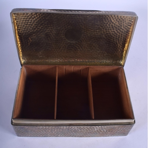 1189 - A LARGE EDWARDIAN HAMMERED SILVER CIGARETTE BOX. 1135 grams inc liner. London 1902. 23.5 cm x 8 cm.