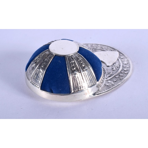 1192 - A SILVER JOCKEY HAT PIN CUSHION. 18 grams. 5.5 cm wide.