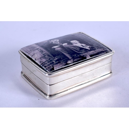 1193 - A SILVER CHARLIE CHAPLIN PILL BOX. 20 grams. 3.5 cm x 2.5 cm.