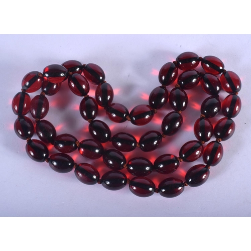 1209 - A CHERRY AMBER STYLE NECKLACE. 30 grams. 38 cm long.