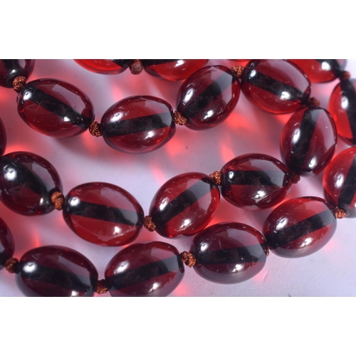 1209 - A CHERRY AMBER STYLE NECKLACE. 30 grams. 38 cm long.