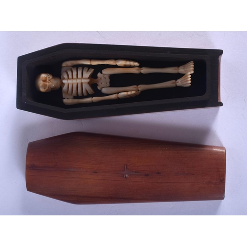 1211 - A CONTINENTAL CARVED BONE COFFIN. 8 cm long.