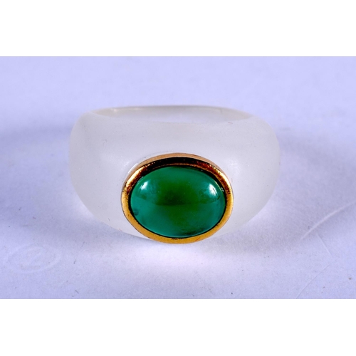 1214 - A CRYSTAL GOLD AND JADE RING. N.