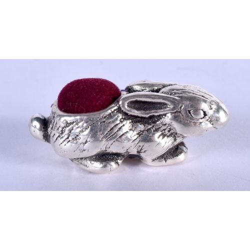 1215 - A SILVER RABBIT PIN CUSHION. 11 grams. 4 cm x 2 cm.