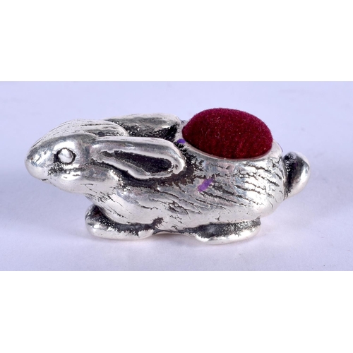 1215 - A SILVER RABBIT PIN CUSHION. 11 grams. 4 cm x 2 cm.