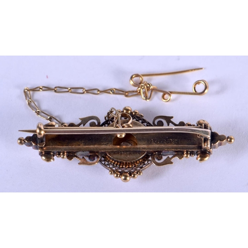 1251 - A 15CT GOLD AND DIAMOND BROOCH. 5 grams. 5 cm x 1.5 cm.