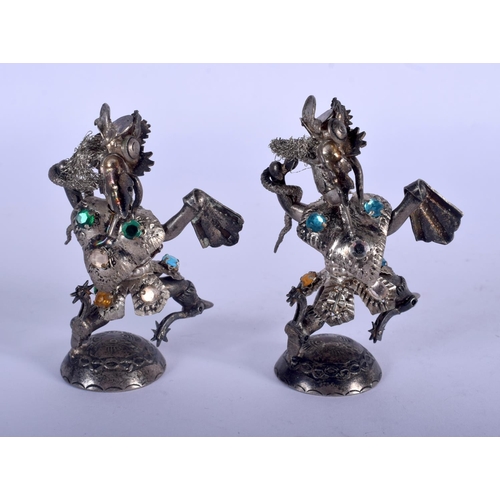 1266 - TWO VINTAGE CONTINENTAL SILVER GEM SET FIGURES. 91 grams. 7 cm high.