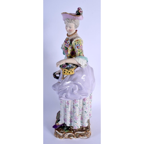 127 - A RARE LARGE 19TH CENTURY MEISSEN PORCELAIN FIGURE OF A STANDING FEMALE modelled holding a floral wr... 