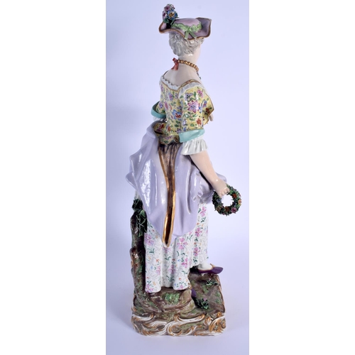 127 - A RARE LARGE 19TH CENTURY MEISSEN PORCELAIN FIGURE OF A STANDING FEMALE modelled holding a floral wr... 