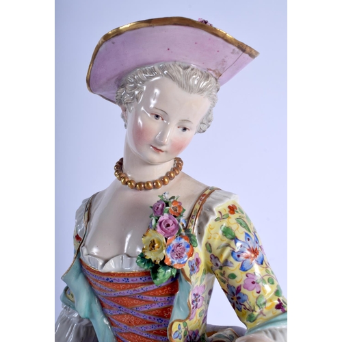 127 - A RARE LARGE 19TH CENTURY MEISSEN PORCELAIN FIGURE OF A STANDING FEMALE modelled holding a floral wr... 