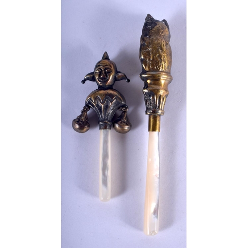 1295 - TWO BRASS RATTLES. 12 cm long. (2)