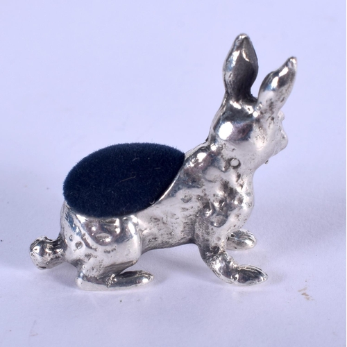 1297 - A SILVER RABBIT PIN CUSHION. 10 grams. 3 cm x 3 cm.