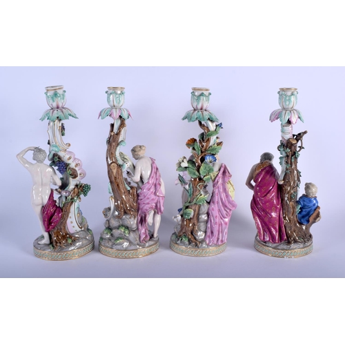 130 - A RARE SET OF FOUR 19TH CENTURY MEISSEN PORCELAIN CANDLESTICKS modelled with figures in various purs... 