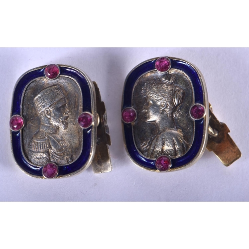 1313 - A PAIR OF CONTINENTAL SILVER AND ENAMEL GEM SET CUFFLINKS. 16 cm long. 1.75 cm x 1.5 cm.