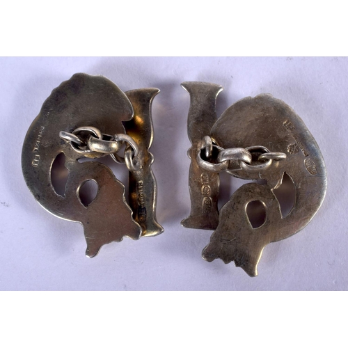 1321 - A PAIR OF CONTINENTAL SILVER GILT FISH CUFFLINKS. 24 grams. 3 cm x 2 cm.