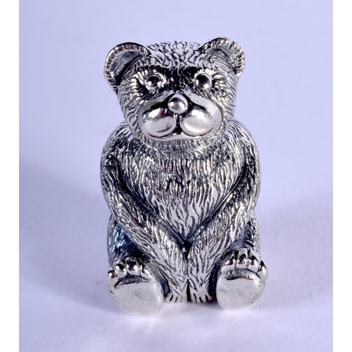 1326 - A SILVER TEDDY BEAR PIN CUSHION. 19 grams. 3 cm x 1.5 cm.