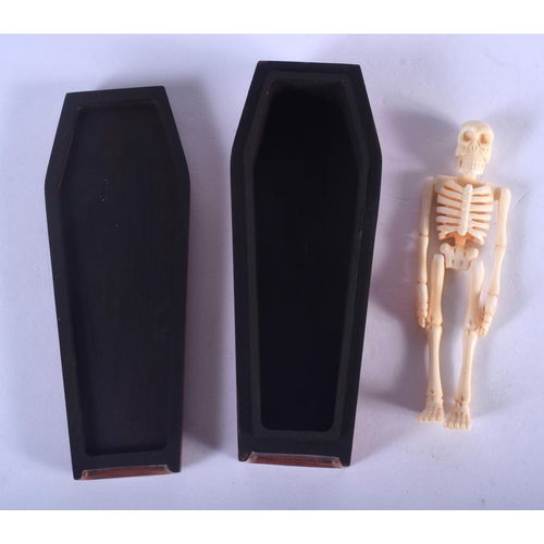 1328 - A CONTINENTAL CARVED BONE AND WOOD COFFIN. 12 cm x 4 cm.