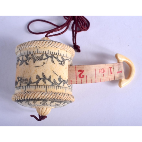 1331 - A BONE TAPE MEASURE. 4 cm x 3 cm.