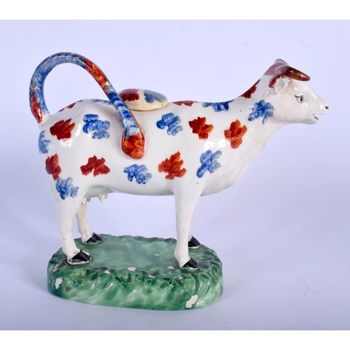 133A - A RARE EARLY 19TH CENTURY WELSH SWANSEA POTTERY COW CREAMER AND COVER C1810 painted with blue and re... 