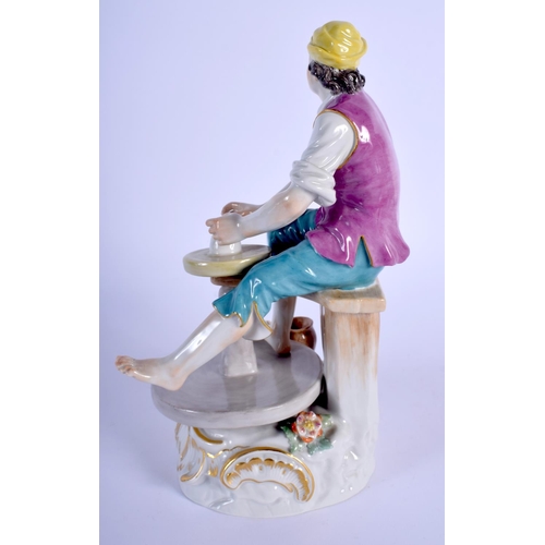 134 - AN EARLY 20TH CENTURY MEISSEN PORCELAIN FIGURE OF A POTTER modelled beside a potting wheel. 21 cm hi... 