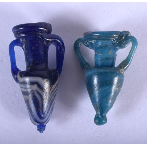 1344 - TWO GRAND TOUR ROMAN STYLE GLASS AMPHORA. Largest 5.5 cm long. (2)