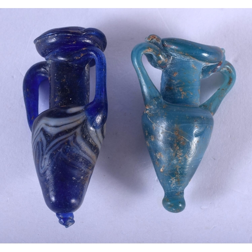 1344 - TWO GRAND TOUR ROMAN STYLE GLASS AMPHORA. Largest 5.5 cm long. (2)