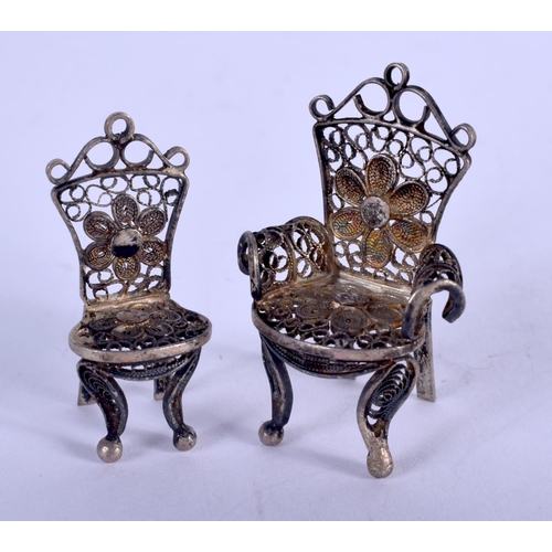 1362 - TWO SILVER CHAIRS. 6.9 grams. 3.5 cm x 2.5 cm. (2)