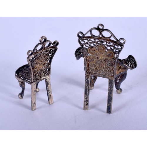 1362 - TWO SILVER CHAIRS. 6.9 grams. 3.5 cm x 2.5 cm. (2)