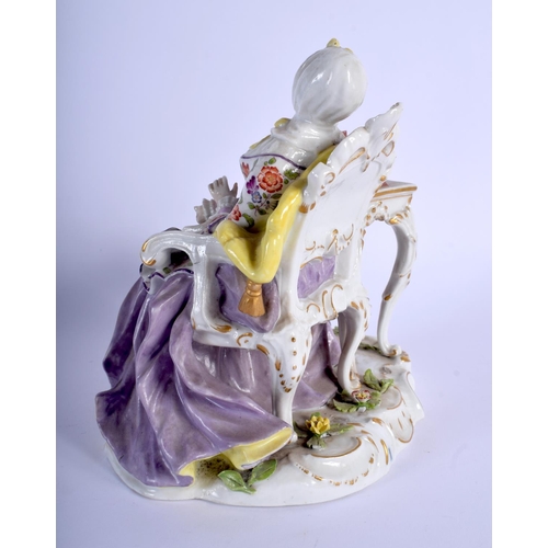 137 - A 19TH CENTURY SITZENDORF PORCELAIN FIGURE OF A SEATED FEMALE modelled seated beside a high table. 2... 