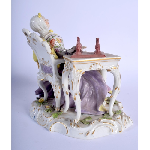 137 - A 19TH CENTURY SITZENDORF PORCELAIN FIGURE OF A SEATED FEMALE modelled seated beside a high table. 2... 