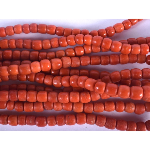 1375 - AN 18CT GOLD MOUNTED CORAL NECKLACE. 288 grams. Each strand 40 cm long.