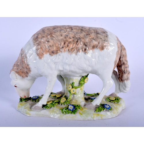 139 - A 19TH CENTURY CONTINENTAL PORCELAIN FIGURE OF A ROAMING LAMB modelled upon a foliate embellished ba... 