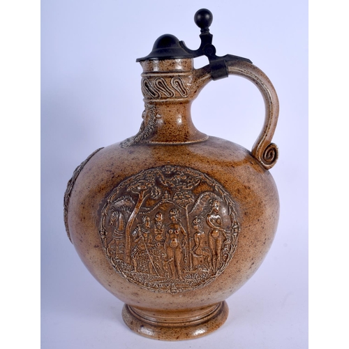 147 - A LARGE ANTIQUE GERMAN BELLARMINE MERKELBACH GRENZHAUSEN BELLARMINE JUG with pewter mounts. 27 cm hi... 