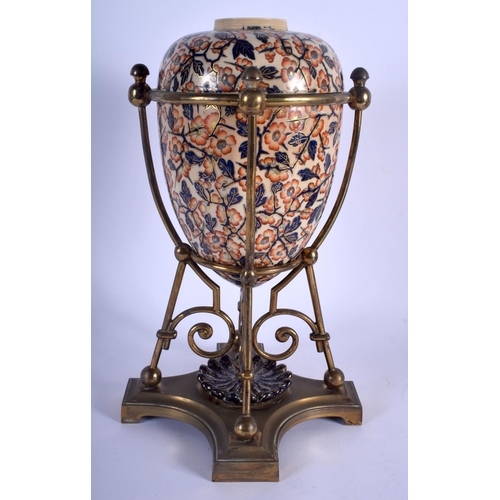 160 - AN UNUSUAL 19TH CENTURY EUROPEAN IMARI TYPE PORCELAIN EGG FORM VASE upon a brass mounted base. 35 cm... 