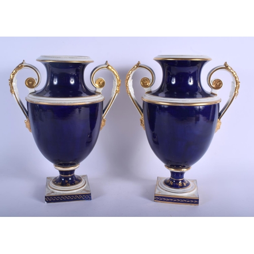 166 - A LARGE PAIR OF 19TH CENTURY DERBY TWIN HANDLED PORCELAIN VASES painted with floral sprays and lands... 