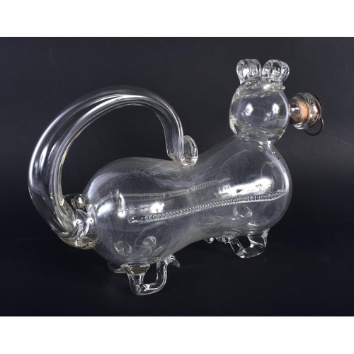 17 - A RARE ANTIQUE CLEAR GLASS NOVELTY DOG DECANTER. 27 cm x 18 cm.