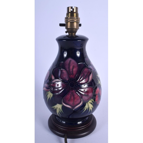 179 - A MOORCROFT PORCELAIN LAMP. Porcelain 16.5 cm high.