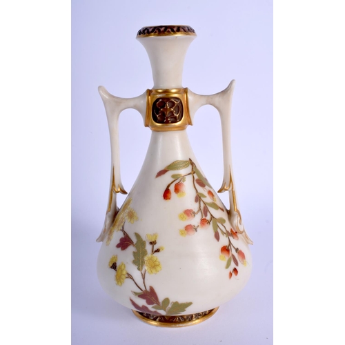 228 - Royal Worcester two handled vase of Eastern inspiration painted with flowers on an ivory ground. c. ... 