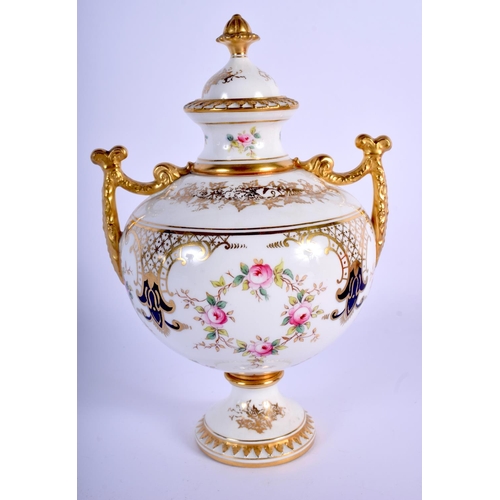 232 - Late 19th/early 20th c. Coalport two handled vase and cover painted with wreaths of roses below gild... 