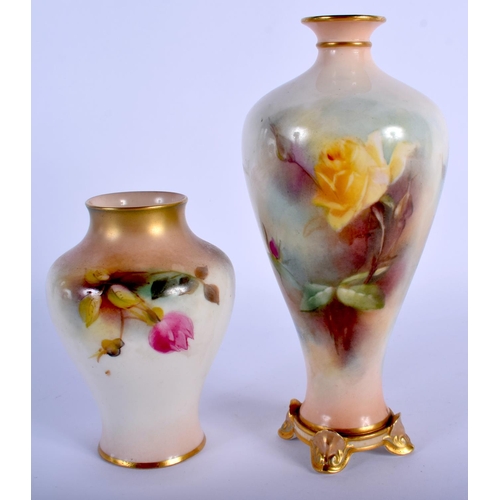 269 - Royal Worcester four footed baluster vase painted with Hadley style pink and yellow roses, date mark... 